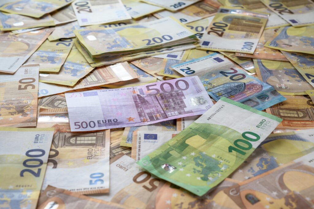 A collection of Euro banknotes representing wealth, savings, and European economy.